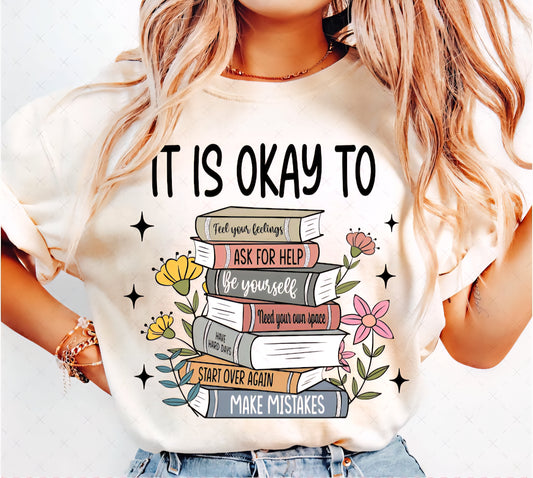 It Is Okay To with books and flowers
